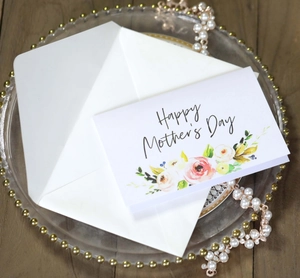 Elegant Mother's Day card with watercolor flowers, white envelope and gold tray