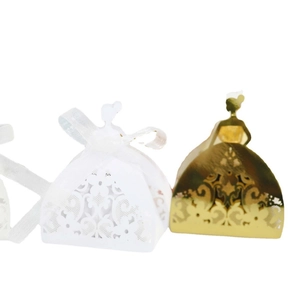 Laser cut favor boxes in white and gold featuring elegant girl silhouettes and ribbons