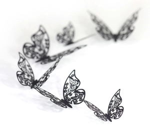3D black hollow laser-cut paper butterflies with intricate lace patterns and 3D folding effect
