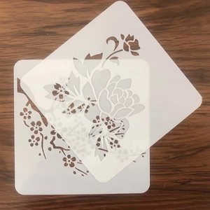 Close-up of translucent flower painting stencils with plum blossom and peony designs