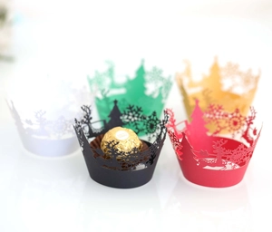 Laser cut Christmas cupcake liners featuring snowflake reindeer and tree patterns