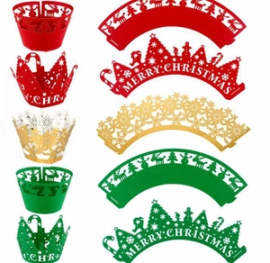 Laser-cut Christmas cupcake wrappers with reindeer, tree and snowflake patterns