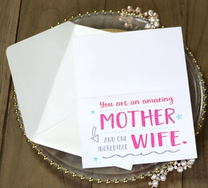 Detailed view of a Mother's Day card with 'Amazing Mother and Wife' text and a white envelope