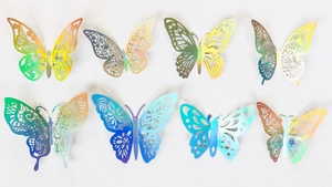 Detail of 3D laser-cut butterfly wall stickers with vibrant iridescent gradient patterns