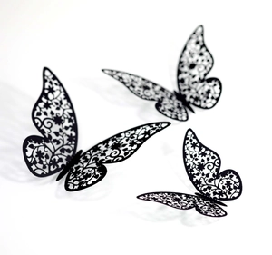 Set of three 3D black laser-cut butterfly wall stickers with intricate floral patterns