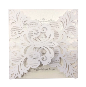 Laser cut white butterfly wedding invitation with Happy Holidays text on pearlescent paper