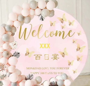 Detail of pink 100 days party backdrop with golden 3D butterflies and balloon decoration