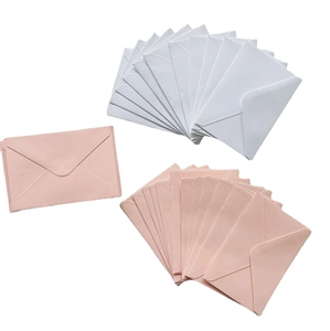 Pink and light blue V-flap envelopes in a stylish fan layout on a white background