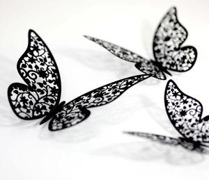 Detailed view of black 3D hollow butterfly wall stickers with intricate floral patterns