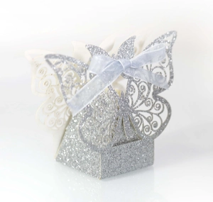 Detail of laser-cut butterfly gift box with silver glitter and lavender ribbon