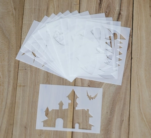 Detailed view of Halloween PET stencils featuring castle and bat patterns for DIY painting