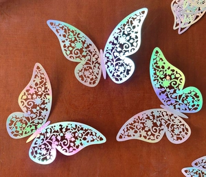 Close-up of 3D hollow butterfly wall stickers with holographic laser metallic finish