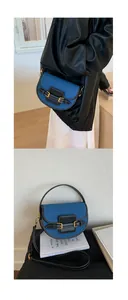 Detail of color-block saddle bag featuring blue denim, black leather, and gold buckles
