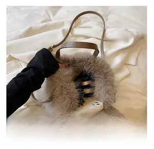 Interior view of soft brown faux fur tote bag showing phone and cosmetic storage space