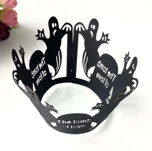 Laser-cut black Halloween cupcake wrappers featuring ghost motifs and The tomb of love text