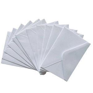 Classic white paper envelopes in a fanned arrangement for western wedding invitations
