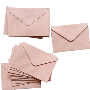 Elegant rose pink V-flap envelopes stack made of premium pearlescent textured paper