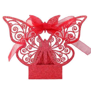 Red glitter butterfly favor box with laser-cut hollow pattern and matching silk ribbon