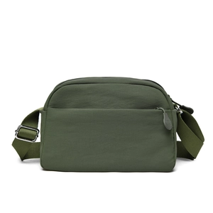 Detail of army green nylon crossbody bag showing multiple pockets and adjustable metal buckle