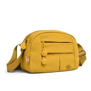 Close-up of yellow nylon crossbody bag with multi-pocket design and round zipper pulls