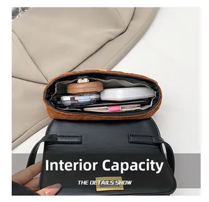 Detailed internal capacity of the brown quilted handbag showing cosmetic items