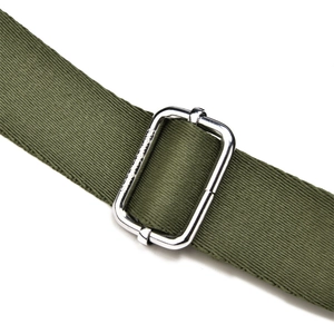 Detail of adjustable olive green woven strap with premium engraved silver metal buckle