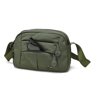 Detail view of military green nylon crossbody bag with multiple zippers and logo