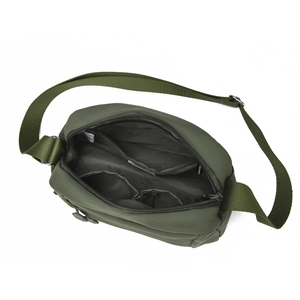 Internal view of a green nylon crossbody bag showing compartments and zipper pockets
