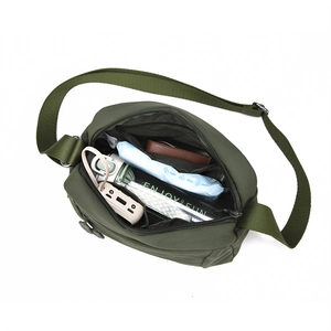 Detail view of olive green nylon bag interior showing multiple pockets and large capacity