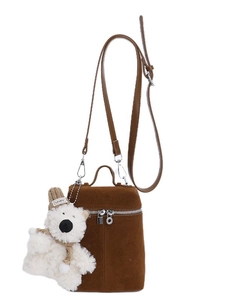 Brown frosted retro bucket bag with white plush bear charm and adjustable shoulder strap