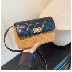 Detail of vintage square crossbody bag featuring quilted stitching and golden twist lock