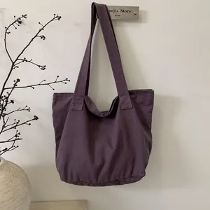 Deep purple canvas tote bag with large capacity and wide straps for daily commuting