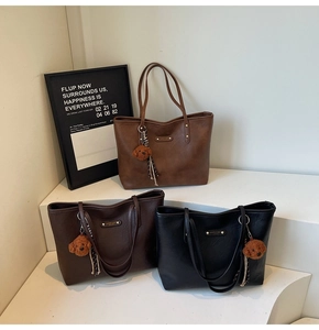 Detailed comparison of large tote bags in brown, coffee, and black with plush dog charms