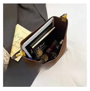 Top view of large brown suede bucket bag interior showing spacious storage for daily items