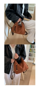 Detail of caramel suede hobo backpack with golden hardware and fringe on brown leather strap