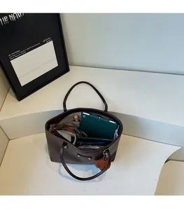 Interior view showing the large capacity of the dark brown tote bag for iPad and daily items