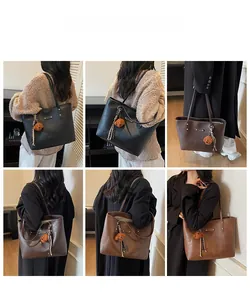 Detail shots of large tote bags in black and brown with cute teddy bear charms