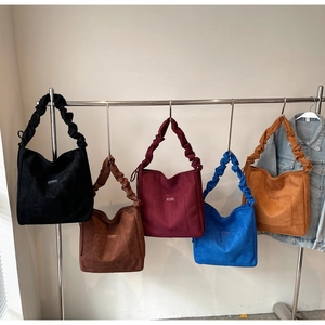 Multiple colors of large vintage canvas tote bags with stylish pleated cloud straps