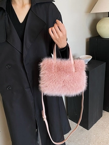 Pink faux fur handbag with leather handle and shoulder strap for women, elegant plush style