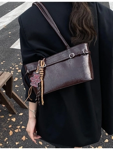 Retro burgundy shoulder bag with glossy crinkle finish and leopard bear charm