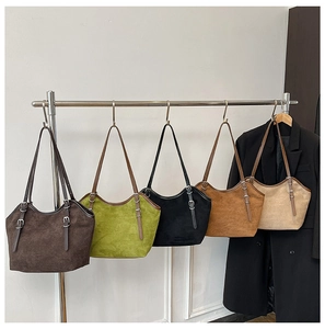 Detail showing high-capacity suede tote bags in five contrast colors with buckled straps