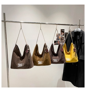 Close-up of leopard print canvas tote bags with various colors and metal ring straps