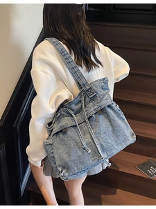 Large denim tote bag with white drawstring design for casual student commute