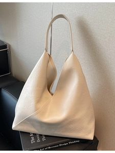 Minimalist beige soft leather tote bag for women showing spacious interior and large capacity