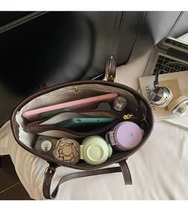 Top view of large tote bag showing spacious interior with multiple compartments and items
