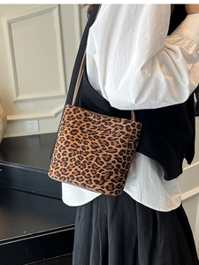 Chic leopard print suede bucket bag with slim leather shoulder strap for women