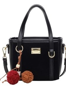 Retro black faux suede crossbody bucket bag with gold logo and fluffy pompom charm