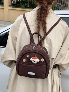 Vintage dark brown suede mini backpack featuring a cute cartoon puppy and wooden buttons