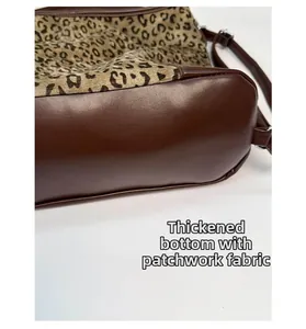 Detail view of leopard print tote featuring thickened bottom and spliced fabric textures
