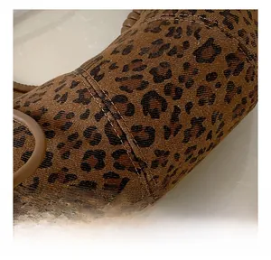 Close-up of leopard print fabric detail with high-quality double stitching craftsmanship